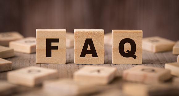 FAQ Sign With Wooden Background