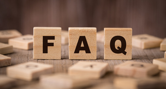 FAQ Sign With Wooden Background